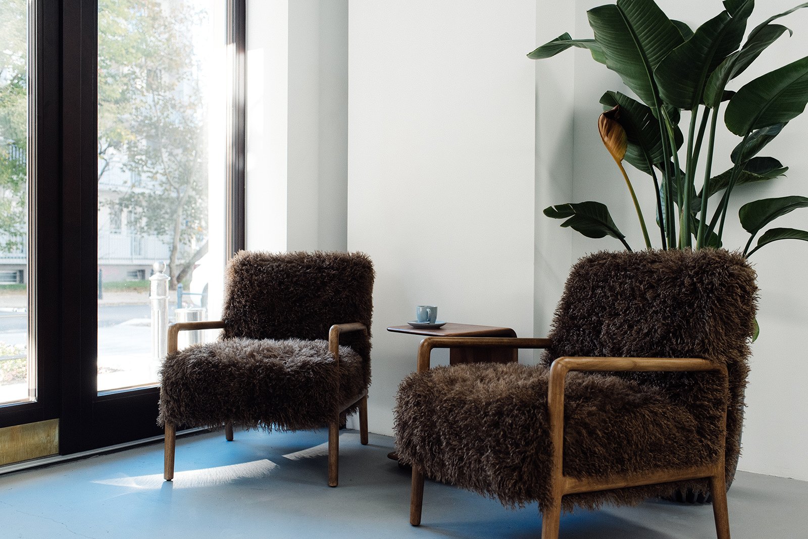 Lounge area at Molot barbershop – armchair by the window, Warsaw